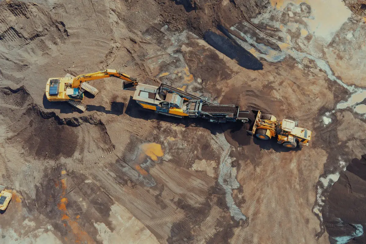 Heavy construction machinery operating in a quarry